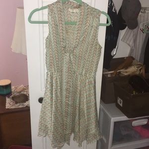 Muted mint colored dress with bird pattern.
